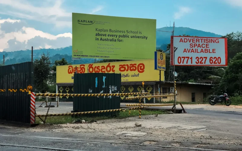 Roadside billboards standing under a clear blue sky