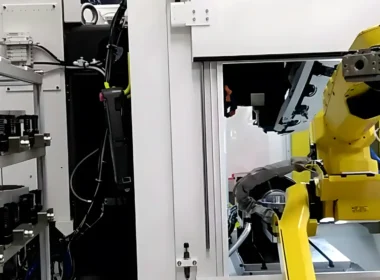 An industrial robot arm working on a factory floor