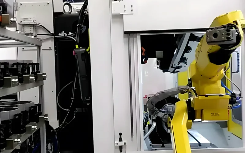An industrial robot arm working on a factory floor