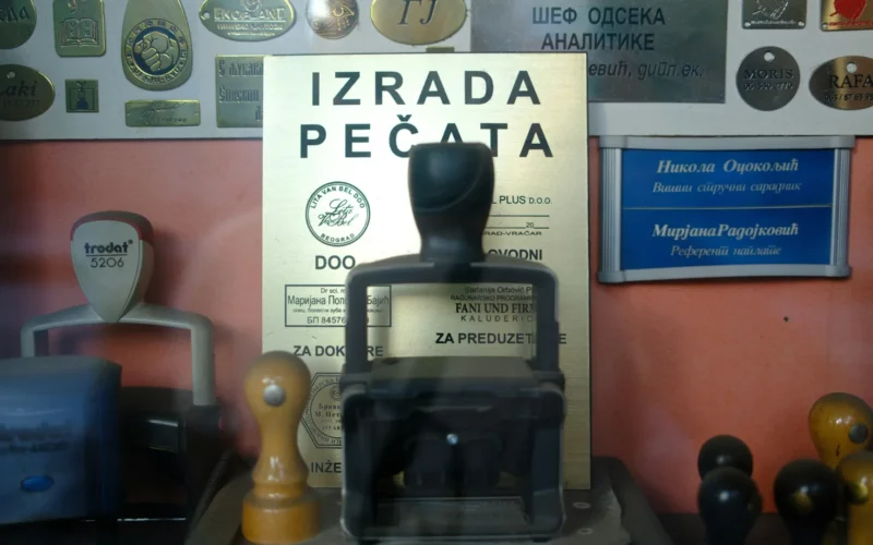 A collection of rubber stamps and plaques laid out on a desk