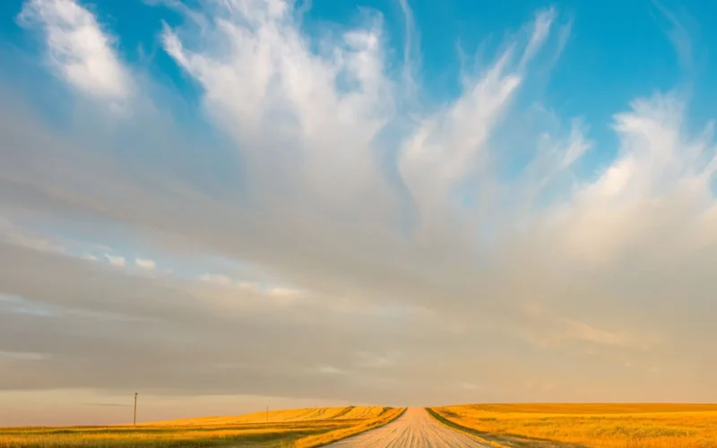 Open prairie road under a wide sky, the kind of rural land Canadian data centre proposals now compete for