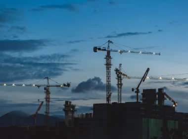 Several cranes above the buildings