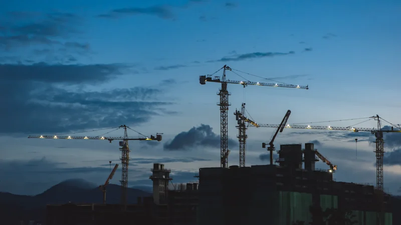 Several cranes above the buildings