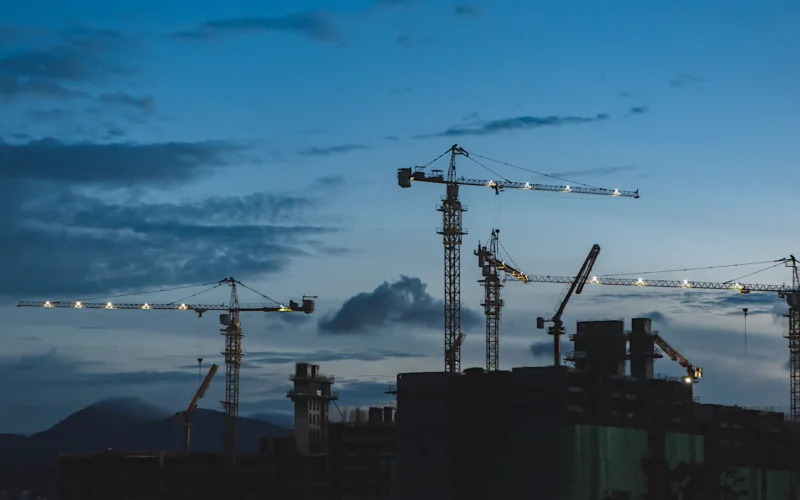 Several cranes above the buildings