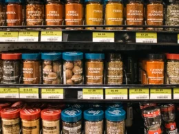 Shelves of jars with price labels in a shop