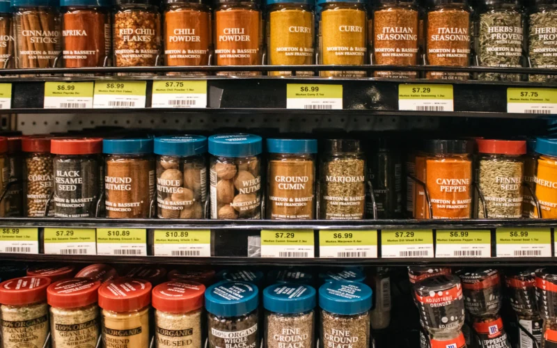 Shelves of jars with price labels in a shop