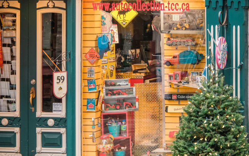 Small store front with a tree outside