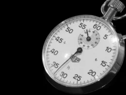 Close-up of a stopwatch against a black background