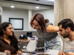 Hiring team in a Toronto office reviewing applications, the step Ontario AI job posting disclosure now covers