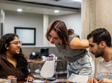 Hiring team in a Toronto office reviewing applications, the step Ontario AI job posting disclosure now covers