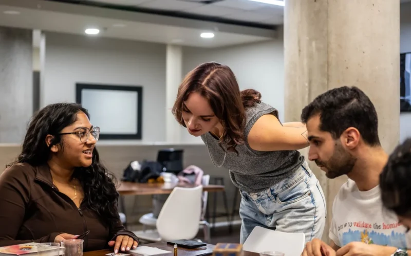 Hiring team in a Toronto office reviewing applications, the step Ontario AI job posting disclosure now covers