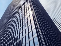 Low-angle view of a glass office tower in downtown Toronto.