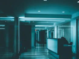 White wooden desk on hallway inside building
