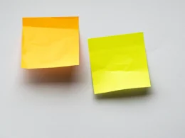 Yellow sticky notes on white wall